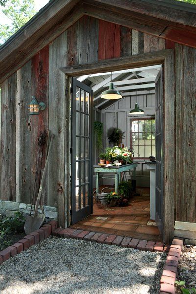 10 She Sheds That Put Man Caves to Shame - Photo 5 of 10 - Inspired by a French farmhouse, this rustic she shed features multi-pane French doors, exposed roof rafters and joists, and earthy terra cotta floor tiles. With its wide-plank wood cladding sitting on gray stone foundations, this shed looks as though it has been around for centuries, but also has a simple, modern sensibility. Modern She Shed, Rustic She Shed, Shed Summer House, Garden Shack, Shed Conversion Ideas, Writing Shed, She Shed Designs, She Shed Plans, Shed Conversion