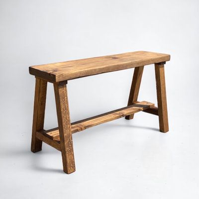 Bring classic style and additional seating or table space to your room with this dual-purpose end table bench. Made with real pine wood, the clean lines, and sturdy construction add a rustic contemporary look to your home. Stained in gorgeous shades perfect to fit any style of home. This piece is at a perfect height to serve as a bench or a modern end table. This bench comes fully assembled and arrives ready to enjoy! Size: 20" H x 35.5" W x 12" D, Color/Pattern: Walnut | Gracie Oaks Traudl Wood