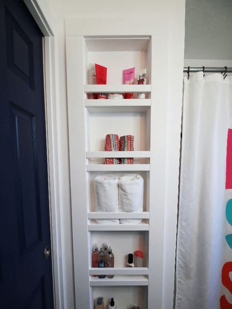 Finding storage solutions for small spaces can be challenging. These clever DIY storage ideas will help you organize the smallest spaces! Open Cabinets In Bathroom, Storage In Between Studs, Built In Shelves Between Studs, Shelves In Between Studs, In Wall Shelves Between Studs, Between The Studs Shelves, Recessed Bathroom Storage, Between The Studs Storage Bathroom, Dormer Bathroom Ideas