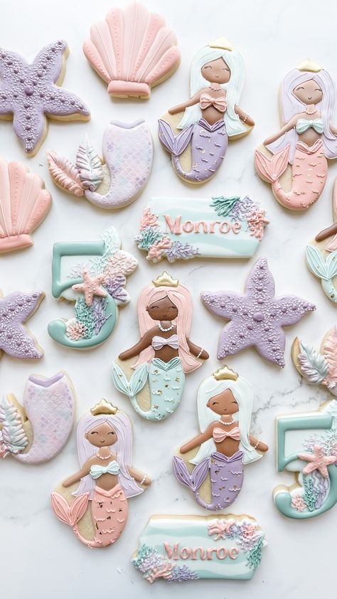 Muted Pastel mermaid under the sea cookies filled with shells, starfish, and coral filled numbers. These girly cookies are perfect for your mermaid at heart's special celebration under the ocean! Let me customize cookies to match your theme, event, and colors! These are decorated royal icing sugar cookies made by The Flour Shoppe Cookie Co, located in Omaha Nebraska. Boho Mermaid Cookies, Mermaid Birthday Party Cookies, Birthday Icing Cookies, Mermaid Party Cookies, Mermaid Sugar Cookies Royal Icing, Mermaid Cookies Ideas, Mermaid Decorated Cookies, Little Mermaid Cookies Decorated, Mermaid Cookies Royal Icing