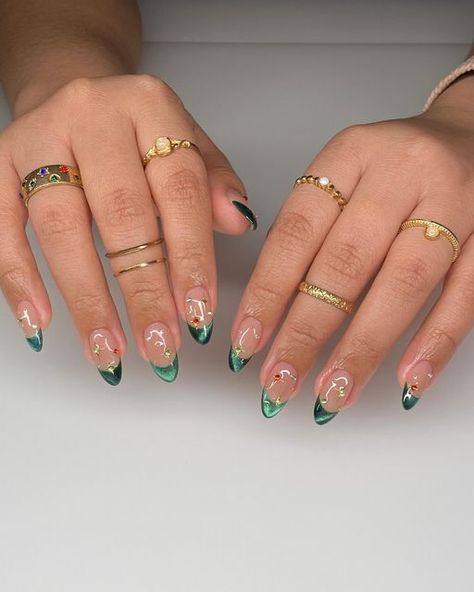 Nail Extensions Las Piñas on Instagram: "emerald green cat eye frenchiess ✨🎄" Colored French Tip With Chrome, Emerald Tip Nails, Emerald Short Nails, Green Cat Eye Nails Christmas, Red And Green Cat Eye Nails, Green December Nails, Emerald Acrylic Nail Designs, Green Cat Eye Nails Design, Green Cat Eye French Tip Nails