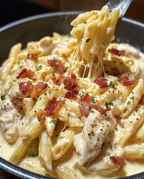 🍗 Creamy Chicken Bacon Ranch Pasta 🧀🥓 Ingredients: For the Pasta Dish: 12 oz pasta (penne or rotini) 2 tbsp olive oil 1 lb chicken breast, cubed 1 tsp garlic powder 1 tsp onion powder Salt and pepper to taste 6 strips bacon, cooked and crumbled 1 cup heavy cream 1 cup milk 1 package (1 oz) ranch seasoning mix 1 ½ cups shredded cheddar cheese ½ cup grated Parmesan cheese 2 tbsp fresh parsley, chopped (for garnish) Directions: Cook the Pasta: Boil the pasta according to package instructions... Alfredo Bacon Pasta, Creamy Chicken Bacon Ranch Pasta, Chicken Cheese Pasta, Cheesey Pasta, Bacon Ranch Pasta, Pasta Creamy, Pasta Cheese, Chicken Bacon Ranch Pasta, Pasta Penne