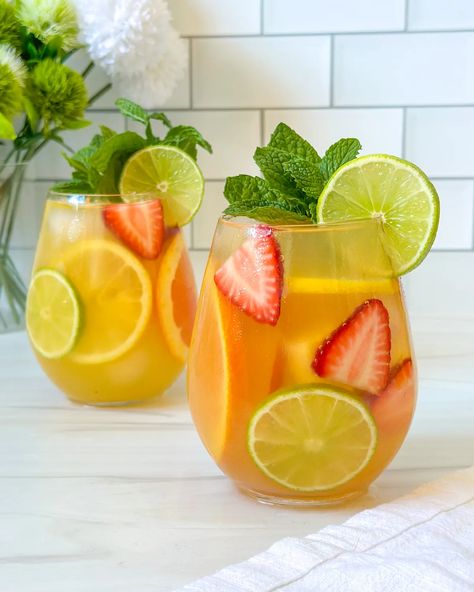 White Tropical Sangria Tropical Sangria Recipe, Tropical Sangria, Batch Cocktails, Apple Brandy, Sangria Recipe, Slice Of Lime, Lemon Lime Soda, Sangria Recipes, Delicious Cocktails