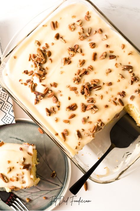 Prepare your taste buds for a southern delight! This easy Kentucky Butter Poke Cake is perfect for any occasion, and you don't need to be a baking expert to make it. Made with yellow cake mix, buttermilk, cream cheese, eggs, butter, vanilla, powdered sugar, milk, chopped pecans and shredded coconut - this delicious cake will have everyone asking for (and craving!) seconds. Don't miss out on this amazing dessert experience - try it now! Pecan Poke Cake Condensed Milk, Butter Pecan Poke Cake, Yellow Cake Chocolate Pudding Poke Cake, Butter Pecan Poke Cake 12 Tomatoes, Banana Poke Cake Condensed Milk, Vanilla Poke Cake, Poke Cake Recipes, Fun Cakes, Poke Cakes