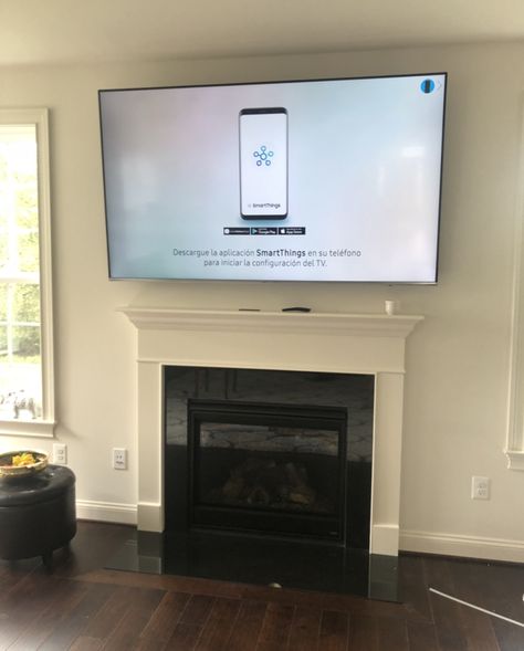 Columbia Maryland. 75” mounted above fireplace and wires concealed. 75 Inch Tv Above Fireplace, Mounted Tv Over Fireplace, Tv With Wall Mount Console And Wall Mount Fireplace, 70” Tv Over Fireplace, Tv Mounted Above Fireplace, Tv Mount Over Fireplace, 75 Inch Tv, 65 In Tv Firplace Mount, Tv Above Fireplace