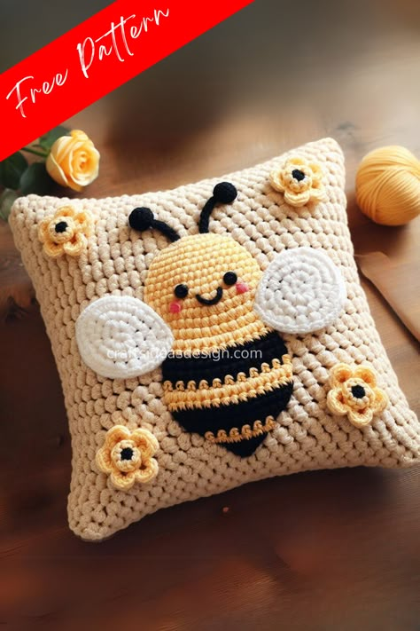 Adorable crochet bee pillow: a whimsical home decor piece with a cute amigurumi bee and colorful flowers. Perfect for adding charm to any room. Ideal for handmade gifts. Bee Pillow Crochet, Crochet Bee Pillow, Bee Crochet, Crochet Pillow Patterns Free, Sunflower Pillow, Bee Wall Art, Baby Cardigan Knitting Pattern Free, Crochet Pillow Cover, Crochet Pillow Pattern