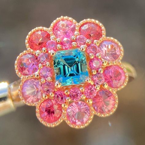 Discover the epitome of elegance with our Teal Tourmaline and Pink Spinel Halo Ring. Crafted in luxurious 14K gold, this stunning masterpiece showcases a mesmerizing teal tourmaline center encircled by a vibrant pink spinel halo. Elevate your style with this unique colored gemstone fusion - a timeless treasure for the sophisticated soul. 💍✨ This piece is sold, please do not order from this link. I put the listing here to showcase the design. Please message me if you are interested to customize Barbie Engagement Ring, Engagement Rings Pink, Bespoke Jewellery Design, Blue Engagement Ring, Pink Spinel, Engagement Ring Rose Gold, Blue Tourmaline, Ring Rose Gold, Pink Jewelry