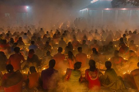 During this religious festival, which is also known as Kartik Brati, Hindus fast and offer prayers by lighting oil lamps and candles. Throughout the country, thousands of devotees also visit temples to pray for good health. Hindu worshipers fast and pray in earnest to the gods for blessings and good health during the traditional ritual called Kartik Brati or Rakher Upobash. Man Pic, Prayer Pictures, Hindu Worship, Fast And Pray, Hindu Temples, Photography Student, Religious Pictures, Village People, Indian Temple