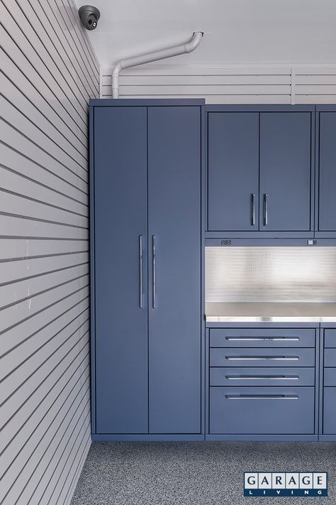 Harbor Blue Garage | Garage Living Blue Garage Walls, Blue Garage Cabinets, Cabinet Systems, Mortar Wash, Garage Cabinet Systems, Light Blue Houses, Blue Garage, Garage Closet, Stainless Steel Backsplash