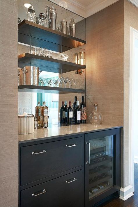 Chic butler's pantry boasts a nook filled with grey cabinets fitted with a glass-front beverage fridge placed under grey floating shelves lining a mirrored backsplash. Bar Nook, Bar Mini, Bar In Casa, Modern Home Bar, Home Bar Design, Built In Bar, Casa Country, Decor Ikea, Home Bar Designs