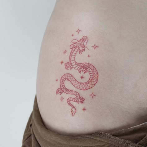 Red Dragon Tattoo Minimalist, Simple Red Dragon Tattoo, Red Dragon Small Tattoo, Tattoo Idea Dragon, Tiny Dragon Tattoo Chinese, Red Colored Tattoos, Dragon Tattoo Symbolism, Cute Dragon Tattoo Ideas, Red Sagittarius Tattoo