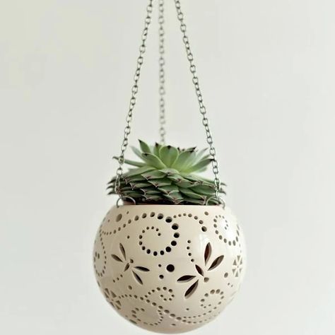 Outdoor · Indoor
Dragonfly pottery hanging flower pot - boho or farmhouse balcony decoration for an orchid or air plant. Enjoy a delightful carved ceramic pot as either a hanging planter or a hanging candle lantern - the choice is yours! The detailed designs are carved by hand into the pottery and either allow air to circulate to your plant or cast fascinating patterns if you use it as a lamp with tealights! These carved pots hang from chains and are perfect for the porch or terrace! Hanging Tea Light Holders, Boho Pottery, Hanging Tea Lights, Succulent Wall Planter, Hanging Candle Lanterns, Dragonfly Ornament, Hanging Candle Holder, Handmade Candle Holders, Hanging Candle