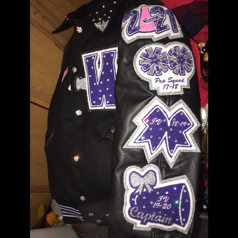 Melissa Bueno on Instagram: “Bling buttons 😍💎💎💎💜🖤” Cheer Letterman Jacket, Cheerleader Jacket, Homecoming Shirts, Letterman Jacket Ideas, Cheer Jackets, High School Homecoming, High School Cheer, School Cheer, Grad Photoshoot