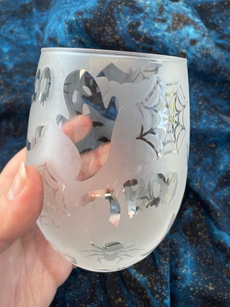 "Who doesn't love something a little different?!  Get Ready for some Spooky Wine time!  This wine glass has been \"reversed etched\" so that means Vinyl was applied then the etching cream then the vinyl peeled off to give you this cloudy look!  Each glasses pattern will look a little different as the vinyl is applied by hand to each glass.  If you would like a custom one please message me to see what we can come up with!  If damaged during shipping I would be happy to replace it for you or give Christmas Wine Glasses Vinyl, Halloween Wine Glasses Diy, Fall Wine Glasses, Halloween Wine Glasses, Etching Diy, Etching Cream, Diy Wine Glasses, Autumn Wine, Decorated Wine Glasses