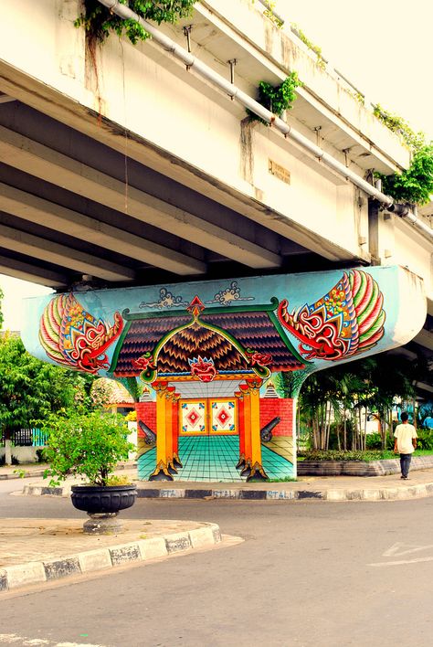 Yttria Ariwahjoedi | mural art in fly-over column. love the colors :) yogyakarta, indonesia. Street Installation, Sidewalk Art, Amazing Street Art, 3d Street Art, Street Graffiti, Murals Street Art, Graffiti Murals, Wow Art, Graffiti Street Art