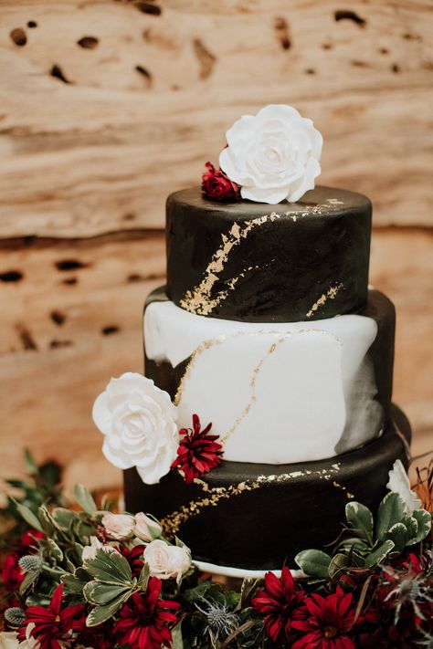 Black and white marbled cake with gold flake Black White Gold Wedding Cake, Black White And Gold Wedding Cake, Black Cake With Gold Flakes, White And Gold Marble Cake, Black And White Marble Wedding Cake, Wedding Cake Marble Gold, White Wedding Cake Black Flowers, White And Gold Wedding Cake, Tennessee Wedding Venues