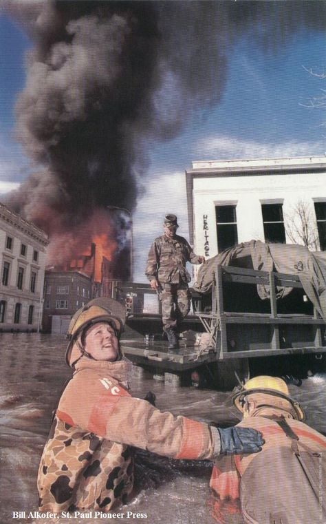 Grand Forks during the 1997 Red River flood in which several downtown buildings caught fire. Grand Forks North Dakota, Downtown Buildings, Red River Valley, Grand Forks, Audio Player, Under Water, River Valley, Red River, Big News