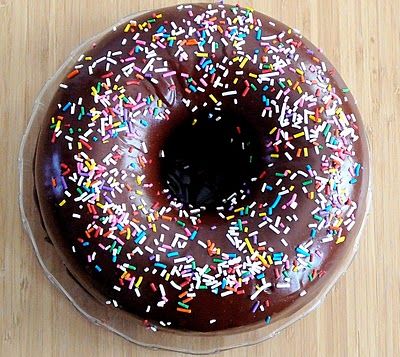 Chocolate glazed donut cake. I want to get a cake pan that looks like a big donut! Fun stuff! Glazed Donut Cake, Chocolate Glazed Donut, Donut Birthday Cake, Big Donuts, Donuts Cake, 25th Birthday Cakes, Donut Cake, Chocolate Glazed Donuts, Glazed Donut