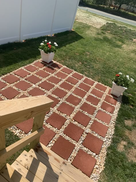 This easy DIY patio is perfect for your summer bbq. For a smaller space. 9x9 for less than $100 49 12x12 pavers 11 bags of yellow river rock  Shovel Rake Measuring flags  Measuring tape. That’s all you need to do this easy project. #diy #project  #patio Diy Simple Patio, Creating A Patio On A Budget, Diy Front Patio Ideas Budget, Cheap Diy Backyard Patio Ideas Simple, Diy Easy Patio Ideas, Patio Using 12x12 Pavers, Easy Diy Backyard Patio, Budget Patio Decor, Diy Cheap Patio Ideas