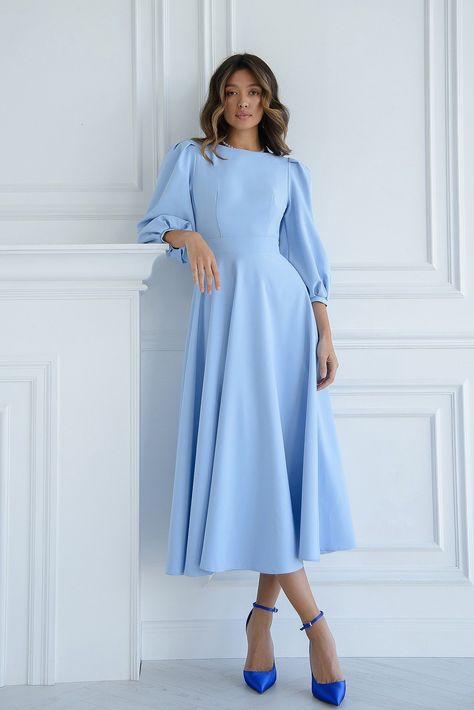 Enter the realm of elegance with ELAGIA's Sky-Blue Backless Puff Sleeve Midi Dress, a graceful ensemble blending chic style and sophistication. The delightful sky-blue hue, coupled with the allure of the backless design and charming puff sleeves, offers a stunning statement piece for any special occasion. #skyblue #backlessdress #puffsleeves #elegantstyle #sophisticatedfashion #womenswear Blue Winter Dress, Light Blue Long Sleeve Dress, Blue Winter Dresses, Sky Blue Outfit, Sky Blue Dress, Backless Midi Dress, Puff Sleeve Midi Dress, Wear Store, Prom Dress Inspiration