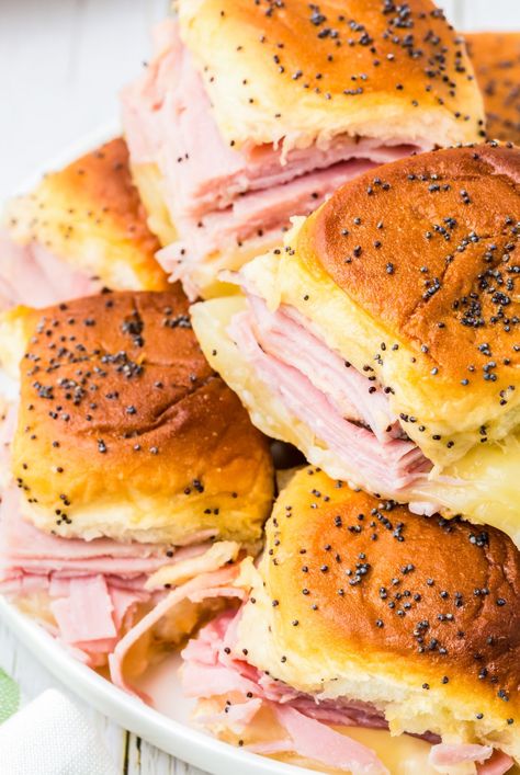 Make these Ham & Cheese Hawaiian Roll Sliders to feed your hungry crowd for dinner, parties, game-day and holidays. Perfectly baked soft rolls filled with ham and cheese then slathered with a honey dijon poppyseed topping. Ham N Cheese Sliders Hawaiian Rolls, Hawaiian Bread Sliders, Hawian Roll Sandwiches, Sliders On Hawaiian Rolls, Hawaiian Roll Sandwiches, Sliders Recipes Hawaiian Rolls, Roll Sliders, Soft Rolls, Stomach Rumbling