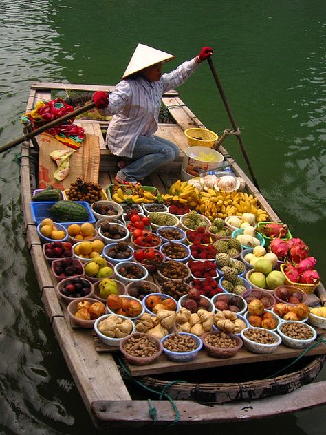 Taken in Halong Bay, Vietnam. These small boats came up to ours selling fruit. Surprisingly, some of the fruit sellers could speak Mandarin - guess they must get plenty of Mainland Chinese tourists here as well. It was 38C the day we were there so the fruit wasn't the freshest which is understandable but it certainly was colorful.. Halong Bay Vietnam, Vietnam Voyage, Halong Bay, Bhutan, Food Market, Vietnam Travel, Mongolia, Hanoi, Iraq