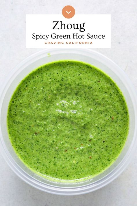 a small container of green sauce on a blue background. Cava Skhug Sauce, Skhug Sauce Cava, Skhug Sauce Recipe, S'hug Sauce Recipe, Zhug Sauce, Skhug Recipe, Schug Sauce, Zhug Recipe, Green Sauces