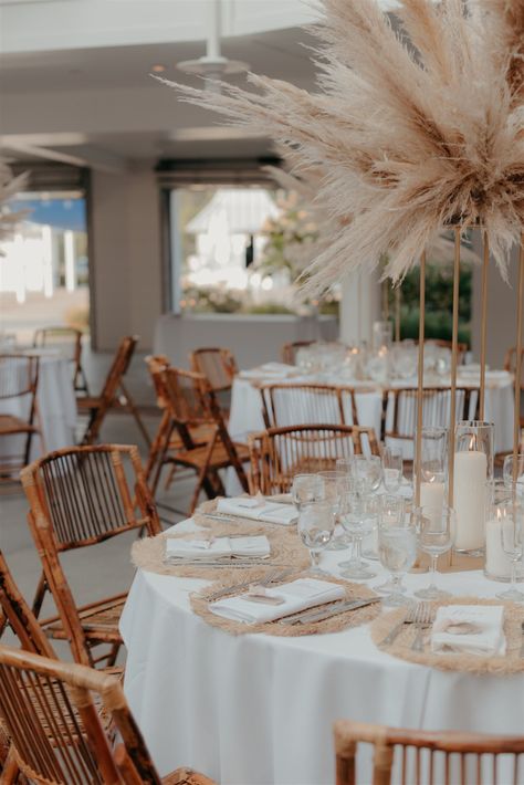 wedding reception photos, wedding photos, wedding photography, wedding photo shot list, boho wedding decor, wedding photo inspo, beach boho wedding, beachy boho wedding, boho wedding reception, boho wedding reception tables, pampas grass centerpieces, bamboo wedding chairs, modern wedding decor Round Table Setting Ideas Wedding Boho, Boho Circle Table Decor, Rustic Bohemian Wedding Centerpieces, Pampas Grass Centerpiece Round Table, Tall Vases Wedding Centerpieces Boho, Boho Wedding Table Arrangements, Simple Boho Reception Decor, Boho Wedding Tablescape Round, Boho Round Table Setting