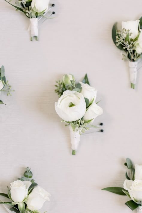 A grooms boutonniere stands out with small white ranunculus. White Bootinterieur, Peony Boutonniere Wedding, Grooms Men Boutonnieres, Mens White Boutineers, Small Ranunculus Bouquet, Buttonholes Wedding White, White Peony Boutonniere, Wedding Bootinterieur, White Bouteniere