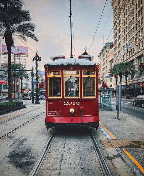 This red street car, decked with christmas decorations and red bows from New Orleans is ready to be get me in the Holiday Season and looks like Christmas has arrived. New Orleans Photography, New Orleans Decor, New Orleans Christmas, New Orleans Vacation, Red Street, Visit New Orleans, New Orleans French Quarter, New Orleans Travel, Big Easy