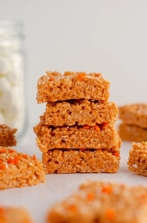 Soft and crunchy pumpkin Rice Krispies treats make an easy, no-bake fall snack recipe for kids to enjoy. They are also one of the best Halloween party dessert ideas. These orange Rice Krispies treats are sure to be a family favorite this fall. | pumpkin rice krispie treats recipe | pumpkin rice krispies recipe | pumpkin rice krispies treats recipe | homemade rice krispies treats pumpkin | pumpkin marshmallow rice krispies | how to make orange rice krispies treats | orange rice krispie treats Pumpkin Spice Rice Krispie Treats, Pumpkin Rice Krispies, Pumpkin Rice Krispie Treats, Pumpkin Rice, Krispie Treats Recipe, Spiced Rice, Rice Krispies Treats, Krispies Treats, Cereal Treats