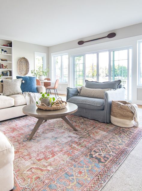 Lake house family room/ tv room. Round coffee table, rust colored vintage rug, white couches Lake House Family Room, Bathroom Transitional, Ruang Tv, Large Living Room Rugs, Furnitur Ruang Keluarga, White Couches, Interior Modern, Design Del Prodotto, Transitional Decor