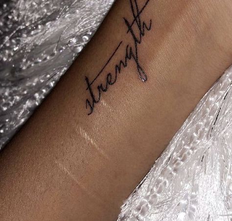 Strength In Cursive Tattoo, Strength Cursive Tattoo, Arm Tattoo Words Writing, Keep Going Quotes Tattoo, Strength Wrist Tattoos For Women, Word Strength Tattoo, Strength Word Tattoo, Collarbone Word Tattoo, Arm Word Tattoos For Women