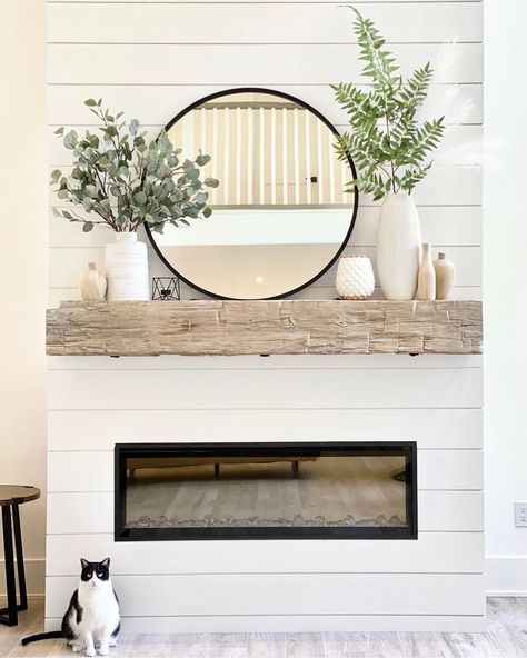 A House We Built on Instagram: “On our fireplace mantel, I mixed white and wood vases with faux greenery for summer. My favorite round black mirror has been the one…” Round Mirror Over Mantle, Mantle Piece Ideas, Mantle Decorating Ideas With Mirror, Fire Mantle, A House We Built, Mirror Over Fireplace, Farmhouse Fireplace Mantels, Mantle Decorations, Mantel Piece