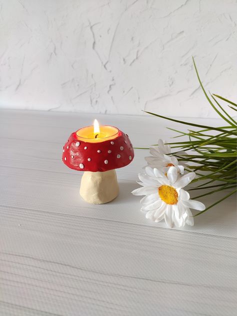 Create a mesmerizing ambiance with this DIY candle decor project, as the warm glow and subtle flicker of candlelight transform any space into a cozy and inviting retreat. Stick Decor, Clay Candle Holders, Mushroom Tea, Clay Candle, Amanita Muscaria, Diy Air Dry Clay, Air Dry Clay Projects, Clay Diy Projects, Diy Candle Holders