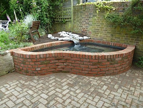 Pond Construction Examples | Women With Waders Brick Pond, Brick Floor Tile, Construction Women, Above Ground Pond, Raised Pond, Pond Construction, Fish Pond Gardens, Brick Floor, Patio Pavers Design