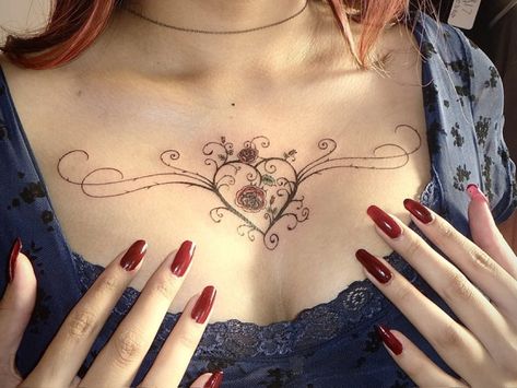 Lacey Heart Tattoo, Knee Bow Tattoo, Sternum And Stomach Tattoo, Lace Tattoos For Women Sleeve, Gothic Chest Tattoo Female, Feminine Chest Tattoo For Women, Early 2000s Tattoos, Female Chest Tattoo Ideas, Heart Tattoo On Chest