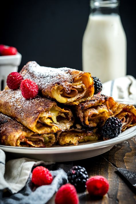 The classic sweet and savory sandwich gets transformed into the perfect rolled-up breakfast in the form of these Monte Cristo Crepes. Stuffed with ham, cheese, and a raspberry-dijon mixture, then dipped in egg and pan-fried in butter, they're as full of flavor as they are impressive when served for a brunch get-together. | hostthetoast.com Picnic Sandwiches, Crazy Kitchen, Savory Crepes, Ham And Cheese Sandwich, Monte Cristo, Crepe Recipes, Gooey Cheese, Mothers Day Brunch, Serious Eats