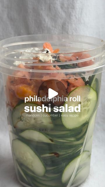 Erin Silberman on Instagram: "Philadelphia Roll Sushi Salad   •Follow @seriousfoodfetish for more recipes, restaurant recs & food trends•  There’s a creator named @logansfewd who has been making this thinly sliced cucumber salad almost every day in a container & changes out the flavors. I couldn’t get it out of my head, so I had to make my own & it’s so incredibly easy since you use a mandolin. Will be making this again tomorrow!   Ingredients  •1 cucumber •smoked salmon, chopped •2-3 T cream cheese  •1 T light soy sauce  •1 T ginger salad dressing  •furikake seasoning   Recipe 1. Use a mandolin to slice a whole cucumber into a container.  2. Add salmon, soy sauce, dressing, cream cheese, & furikake. Shake until well combined.  3. Serve in a bowl with more furikake on top. Enjoy!" Cucumber Sushi Salad, Sushi Cucumber Salad, California Roll Cucumber Salad, Furikake Seasoning Recipe, Philadelphia Roll Sushi, Philadelphia Roll, Ginger Salad Dressing, Soy Sauce Dressing, Cucumber Salads