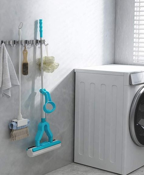 A mop storage rack that'll keep your brooms and mops from knocking over every five seconds. It's equipped with hooks and clasps, so you can hang all the things! Mop Storage, Garden Tool Holder, Modern Towels, Tool Hangers, Mop Holder, Broom Holder, Laundry Room Bathroom, Hanger Storage, Kitchen Cleaning Supplies