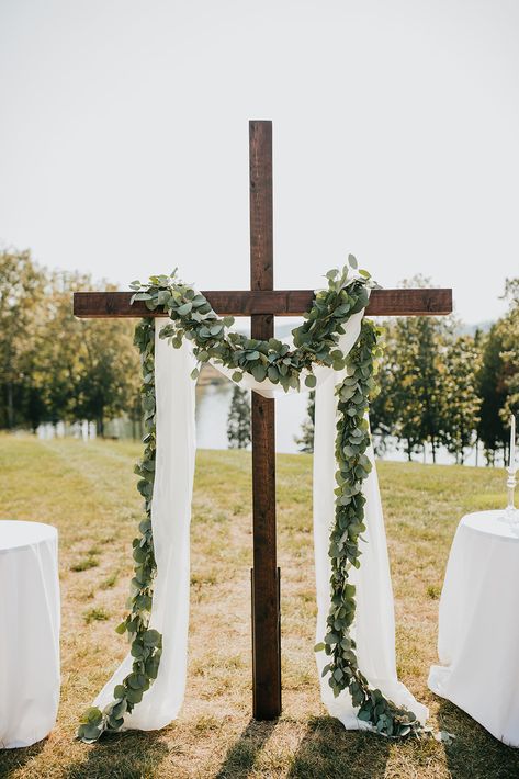 Wedding Cross Flower Arrangement, Wedding Ideas Alter, Cross Wedding Alter Flowers, Wedding Cross With Greenery, Cross With Drape, Cross Center Piece Wedding, Cross Ceremony Backdrop, Cross Alter With Flowers, Wedding Cross Backdrop