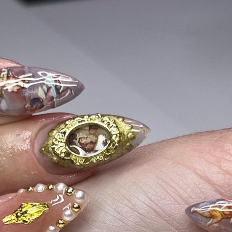 10th Dimension Nails || Chicago on Instagram: "Recreated one of my renaissance sets using @southtxnailsupply Antique Gold Liner and Gold Frame Charms! Please feel free to book more of these! #chicagonails #chicagonailtech #chicagonailtechs #chicagonailartist #chicagopressonnails #chicagofashion #chicagostreetwear #renaissancenails #renaissancenailart #angelnails #cherubnails #cherubnailart #angelnailart #goldnails #goldchromenails #renaissancefashion #nailsofinstagram #nailinspo" Picture Frame Nails, Dimension Nails, Frame Nails, Gold Chrome Nails, Gold Liner, Pedi Ideas, Angel Nails, Really Cute Nails, Long Acrylic