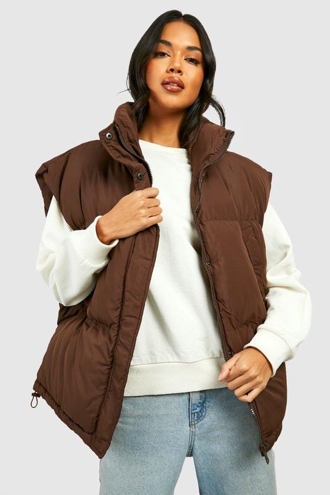 Womens Oversized Boxy Vest - Brown - 6 - Add a different type of layer to your look with this vest, a sporty and stylish piece. This sleeveless jacket closely resembles a waistcoat and is perfect for throwing over long sleeve tops, sweaters, and lightweight coats. This body warmer can add that much-needed extra insulation to your outfit during colder months without making you feel too bulky. Style this women's vest with a sports outfit, work attire, or everyday look.Style: GiletLength: RegularSl Brown Vest Outfit, Jacket Without Sleeves, Sleevless Jacket, Boxy Vest, Waistcoat Designs, Sports Outfit, Outfit Work, Brown Vest, High Waisted Mom Jeans