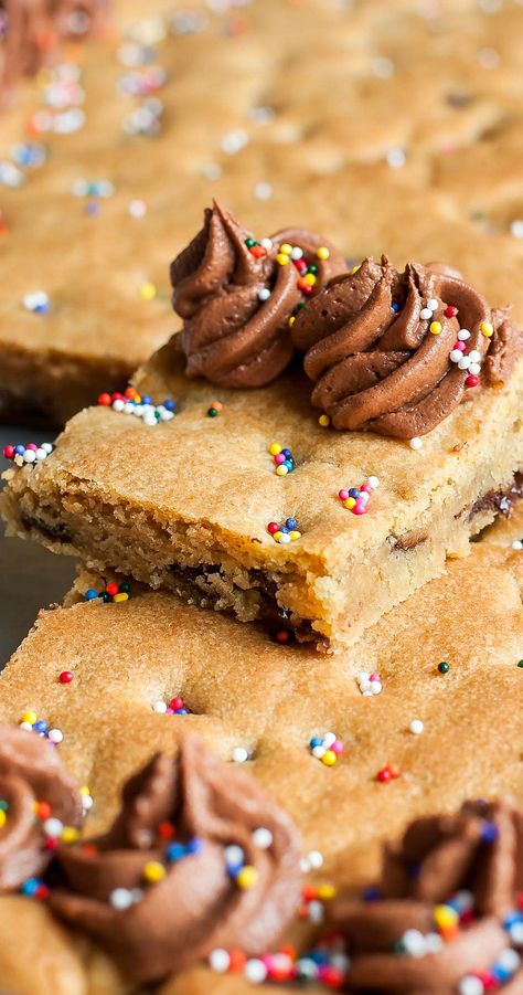 Celebrating a birthday or special occasion? whip up this giant sheet pan cookie cake recipe! This classic chocolate chip cookie cake is the ultimate birthday cake! I make mine with an easy homemade Chocolate-Peanut Butter Frosting and it's sure to be your new go-to dessert for parties, potlucks, and everything in between! Sprinkles optional but encouraged! Cookie Cake Homemade, Large Chocolate Chip Cookie Cake, Double Decker Cookie Cake, Large Cookie Cake Recipe, Cookie Cake Sheet Pan, Cookie Cake Recipe Sheet Pan, Sheet Cookie Cake, Best Cookie Cake Recipe, Square Cookie Cake