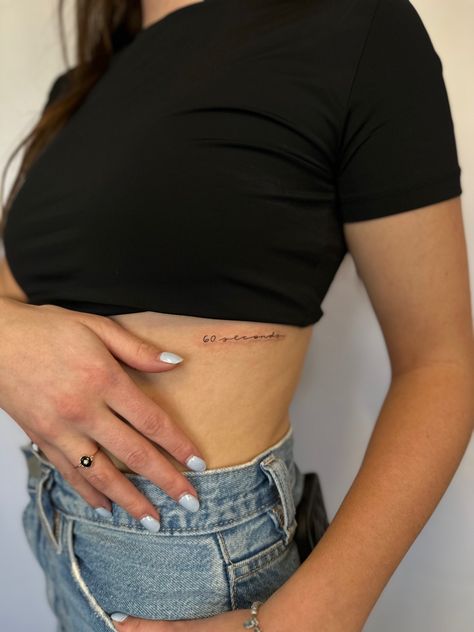 60 Seconds Tattoo, Line Rib Tattoo, Fine Line Rib Tattoo, Floral Skirt Outfits, Small Pretty Tattoos, Writing Tattoos, Cute Tiny Tattoos, Rib Tattoo, Tattoos Ideas