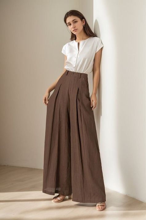 You can Pair them with a fitted top for a balanced look. Elevate your wardrobe - experience the blend of luxury and comfort with our linen wide-leg pants. DETAILS: * 100% linen, the wide-leg pants is made from high-quality linen, providing a breezy and comfortable feel. * Two side pockets * Zipper and button front closure * Pleated detail * High waisted pants * Wide leg pants * Perfect for spring, summer * Dry clean MODEL SIZE Bust 85 cm(33.4") Waist 67 cm(26.7") Height 168cm (5' 6") She wears s High Waisted Linen Pants, Long Linen Pants, Korean Pants, High Waisted Pants Outfit, Formal Women, Fitness Outfits, Best Prom Dresses, Workout Wardrobe, Pretty Prom Dresses