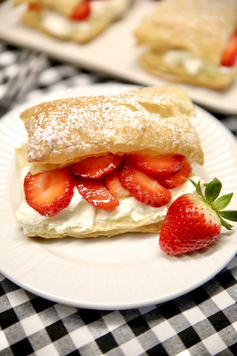 Easy Strawberry Napoleons are a delicious dessert that everyone will love. Flaky puff pastry layered with the easiest pastry cream and fresh strawberries. Strawberries And Cream Puff Pastry, Puffed Pastry Strawberry Dessert, Puff Pastry And Strawberry Recipe, Puff Pastry Strawberry Shortcake, Strawberry Desserts Puff Pastry, Strawberry Napoleon Puff Pastries, Puff Pastry With Strawberries, Puff Pastry Sheet Recipes Desserts, Strawberry Puff Pastry Recipes