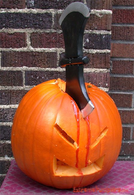 ExtremePumpkins.com - Extreme Pumpkin Carving Pumpkin With Knife In Head, Pumpkin With Pumpkin In Mouth Carving, Chainsaw Carved Pumpkins, Pumpkin Carving Knife, Scary Pumpkin Carving, Pumpkin Meme Humor, Funny Pumpkin Carvings Meme, Pumpkin Carving Designs, Halloween Pumpkin Designs