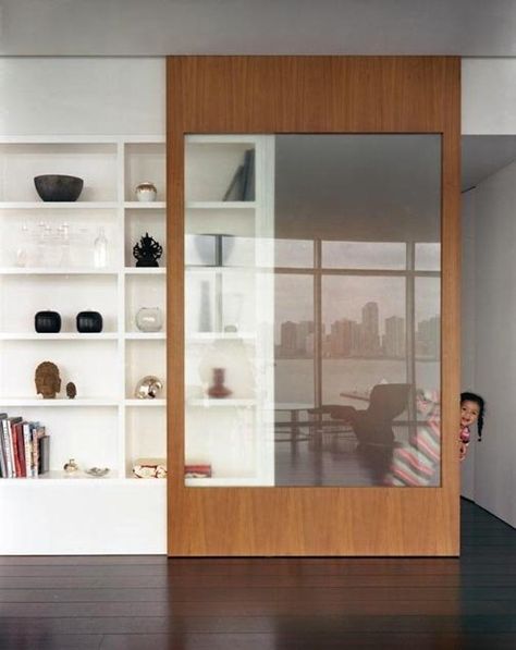 Sliding bookcase door made out of light colored wood, perhaps this is an ideal solution when looking to divide a 1970's lounge dining room. The large glass panel gives great privacy without blocking out light. Bookcase Door, Cabinet Fronts, Design Del Prodotto, Interior Barn Doors, Cool Ideas, Barn Doors Sliding, Interior Door, Glass Doors, Sliding Door