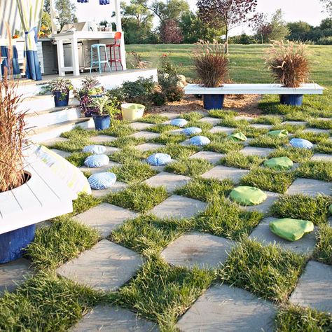 Create an interesting landscape feature and keep guests of all ages entertained with an outdoor checkerboard. Directions: Rent a sod cutter from a local hardware store and clear the area of grass where you'll create the checkerboard design. Lay out concrete outdoor pavers in the desired pattern. Lay sod between the pavers and use a knife to cut the sod as needed. Fill in with extra dirt so the sod is even with the pavers. You want the sod to be equal with the pavers so you can mow right over the Outdoor Checkerboard, Diy Outdoor Living, Outdoor Pavers, Cheap Backyard, Outdoor Room, Summer Living, Outdoor Diy Projects, Outdoor Retreat, Hardware Store